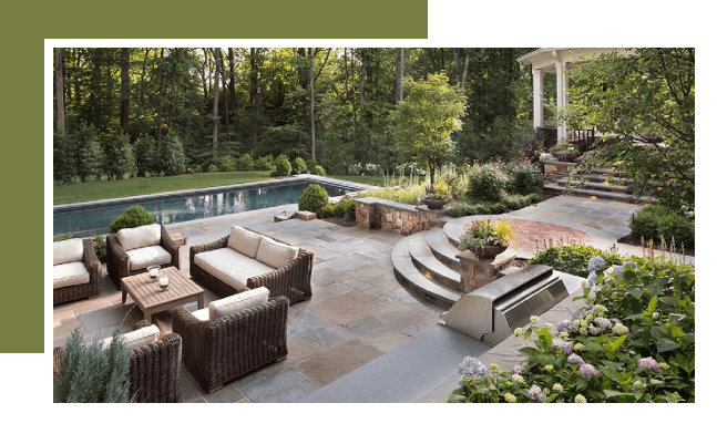 A patio with furniture and a pool in the background.