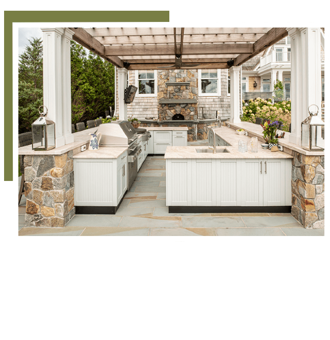 A large outdoor kitchen with an oven and sink.